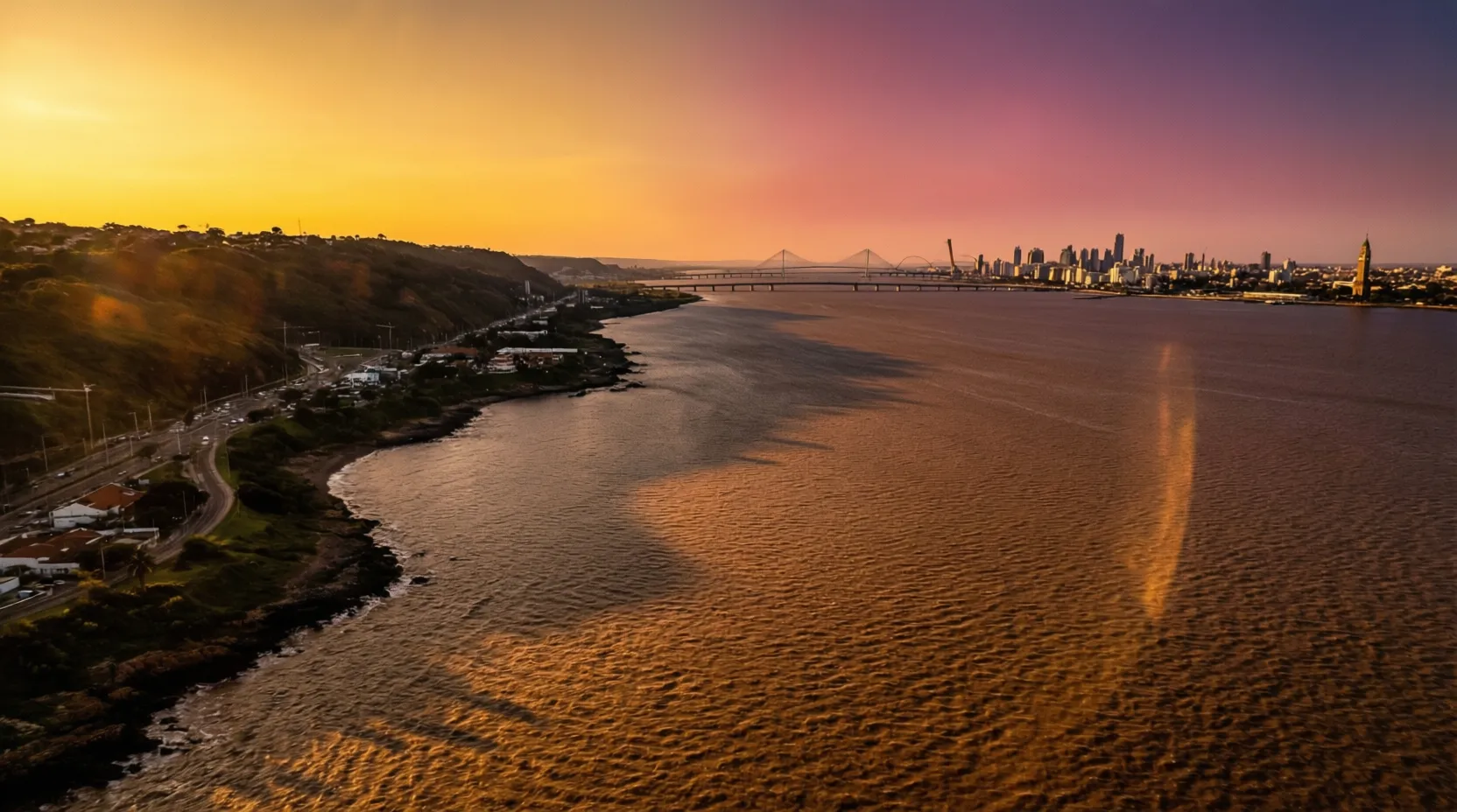 Vista aérea del Río de la Plata separando Uruguay y Argentina, símbolos de ambas naciones